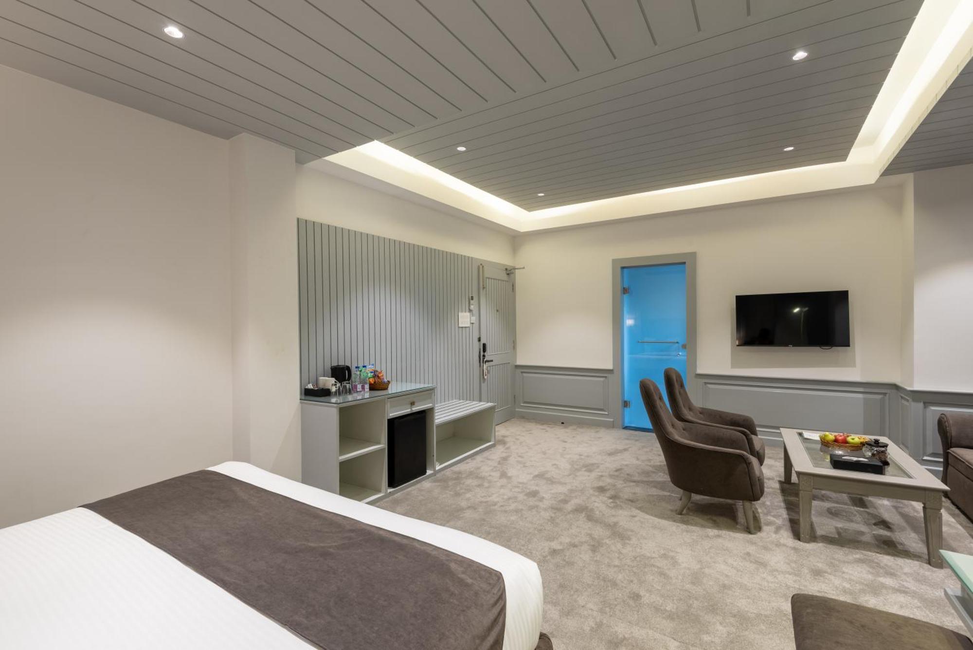 Hotel Grand Boulevard Durgjan Bilik gambar