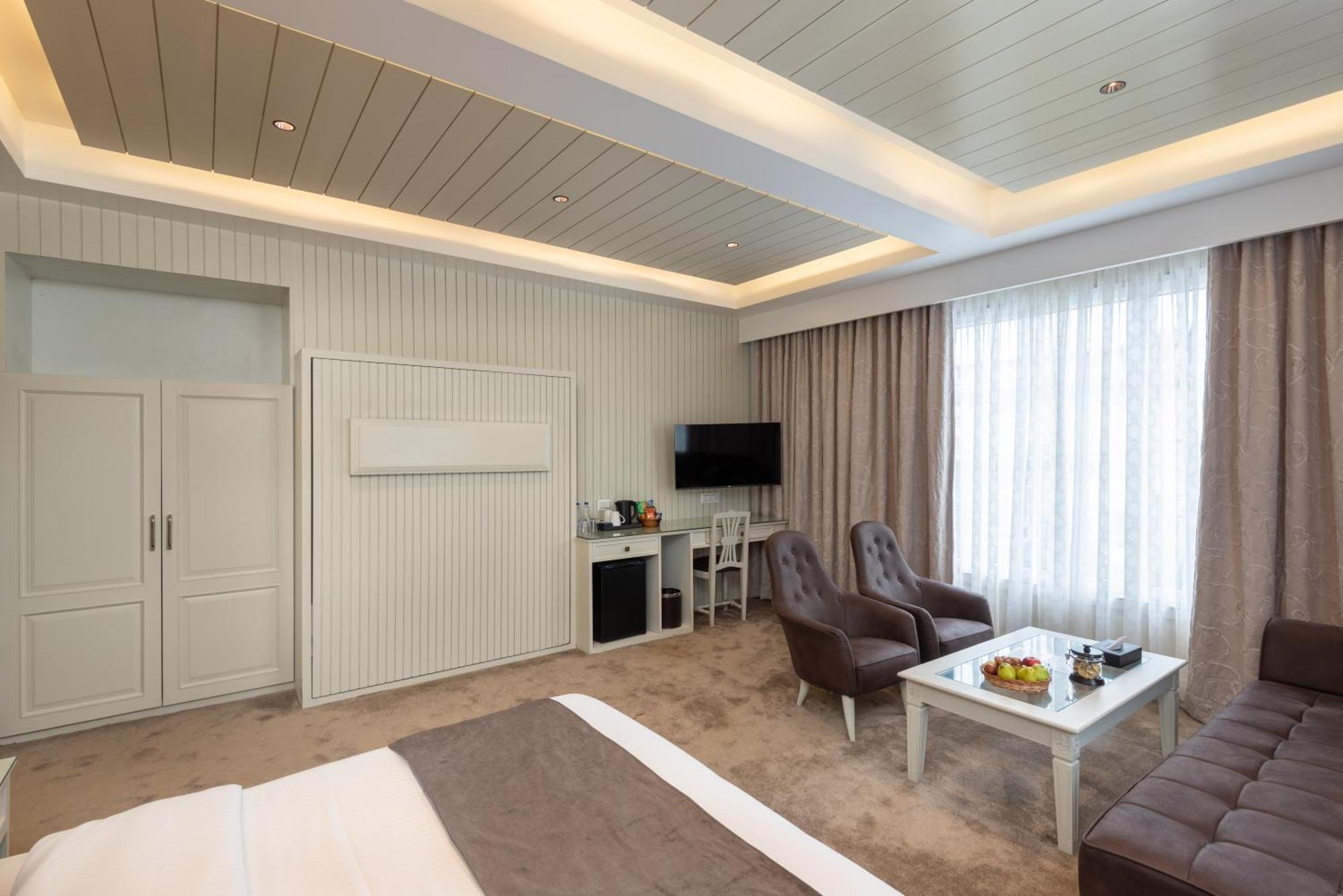 Hotel Grand Boulevard Durgjan Bilik gambar